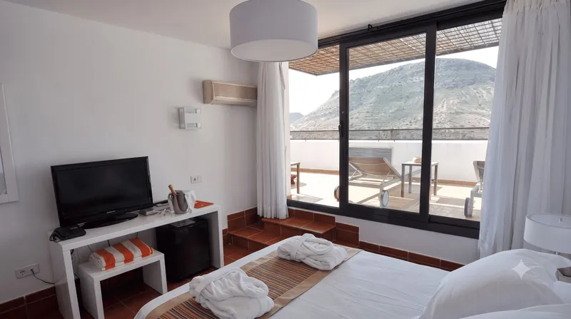 Doble Superior con Jacuzzi - cama y terraza